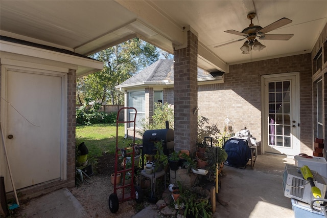 view of patio featuring area for grilling and ceiling fan