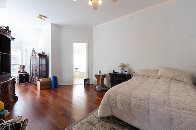 bedroom with ornamental molding, ensuite bath, ceiling fan, and dark wood-type flooring