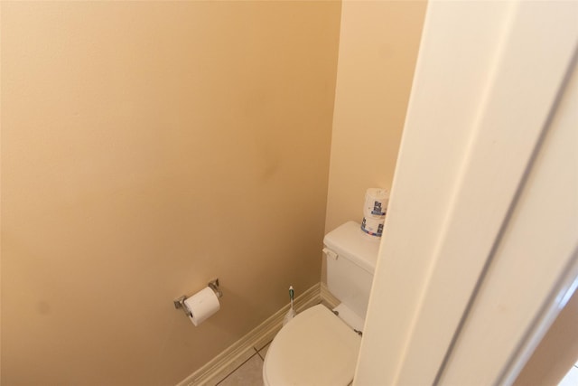 bathroom featuring tile patterned flooring and toilet