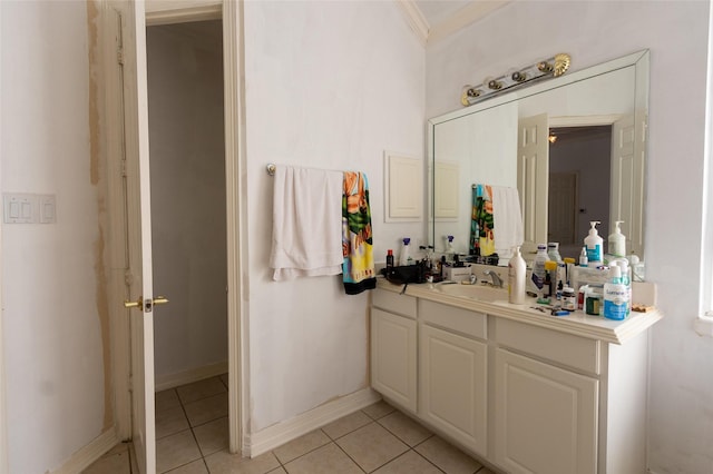 bathroom with tile patterned flooring, vanity, and ornamental molding