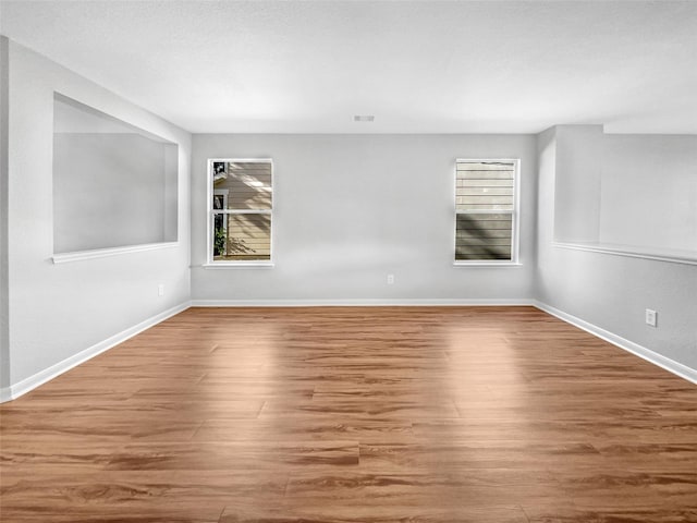 empty room featuring hardwood / wood-style flooring