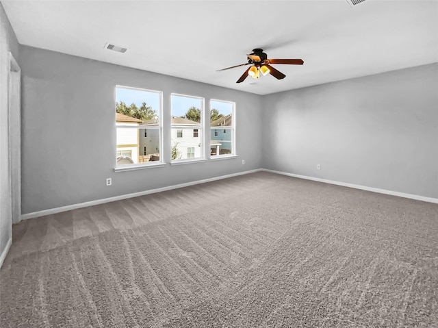 carpeted empty room featuring ceiling fan