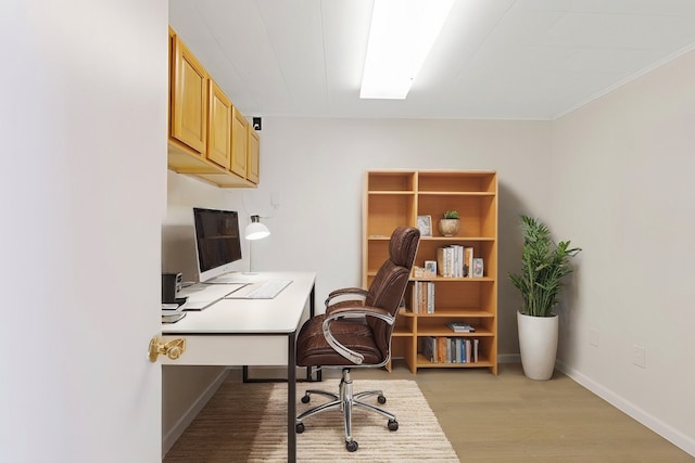 office with light wood-type flooring