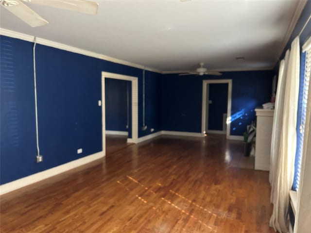 unfurnished room featuring dark hardwood / wood-style floors, ceiling fan, and ornamental molding