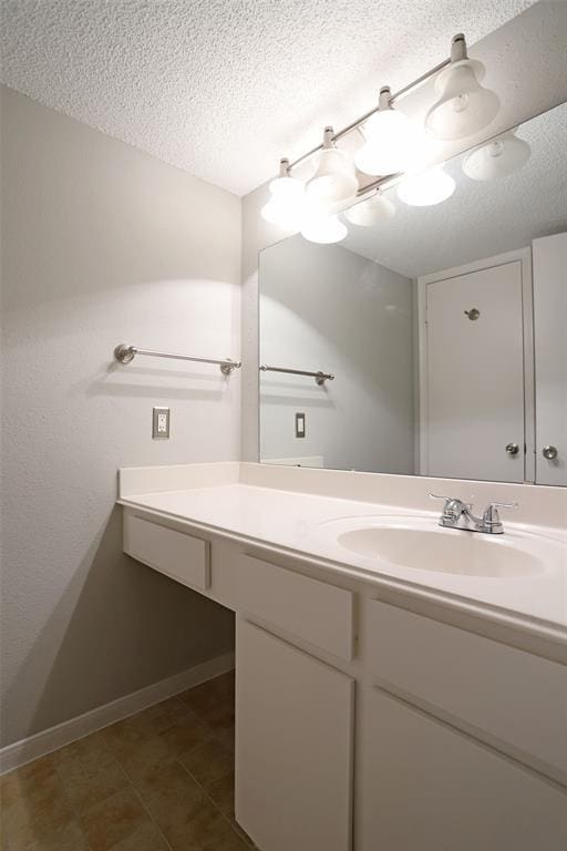 bathroom featuring vanity and a textured ceiling