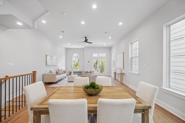 dining area featuring ceiling fan, light wood-type flooring, and french doors