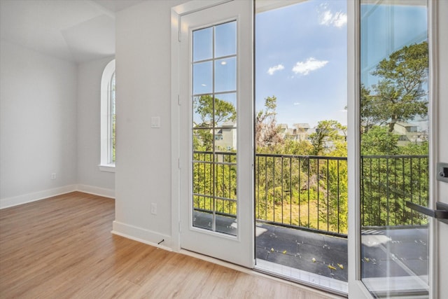 doorway to outside with light hardwood / wood-style flooring