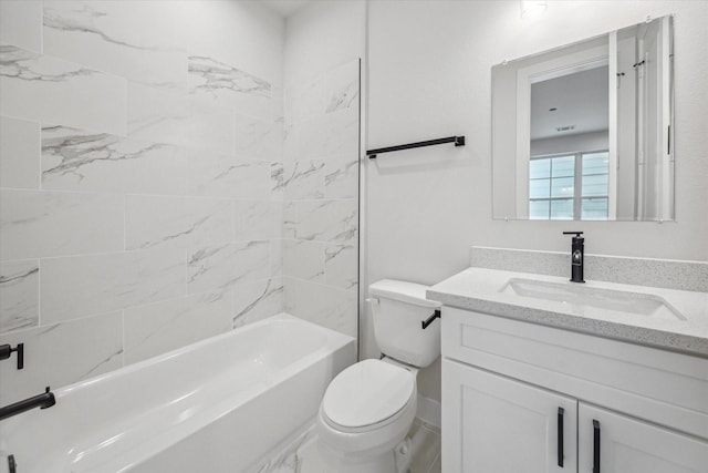 full bathroom featuring vanity, tiled shower / bath combo, and toilet