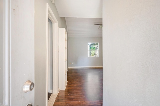 hall with dark wood-type flooring