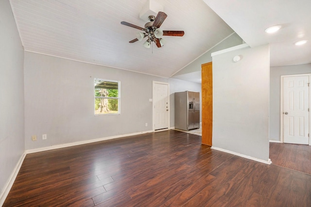 unfurnished living room featuring ceiling fan, dark wood-type flooring, and vaulted ceiling