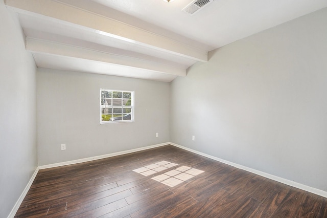 unfurnished room featuring beamed ceiling and dark hardwood / wood-style floors