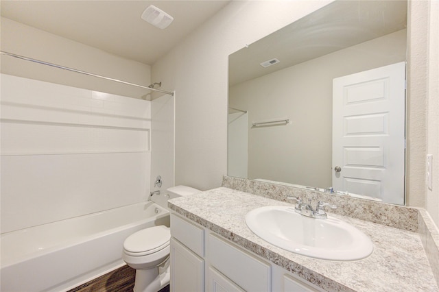 full bathroom with vanity,  shower combination, hardwood / wood-style flooring, and toilet