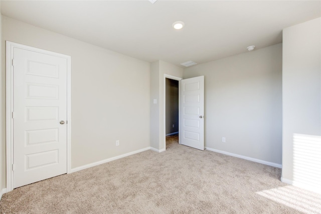 interior space featuring light colored carpet