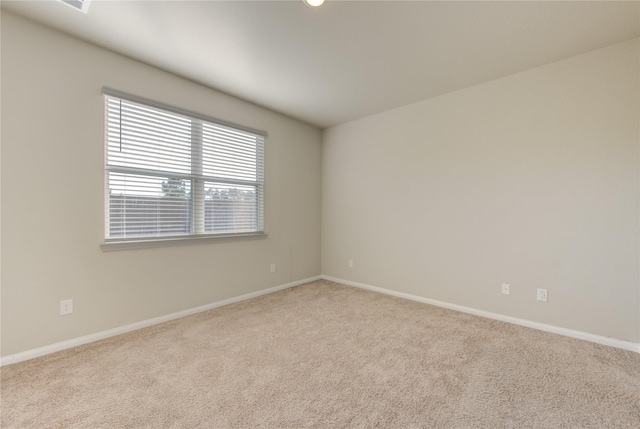 empty room featuring light colored carpet