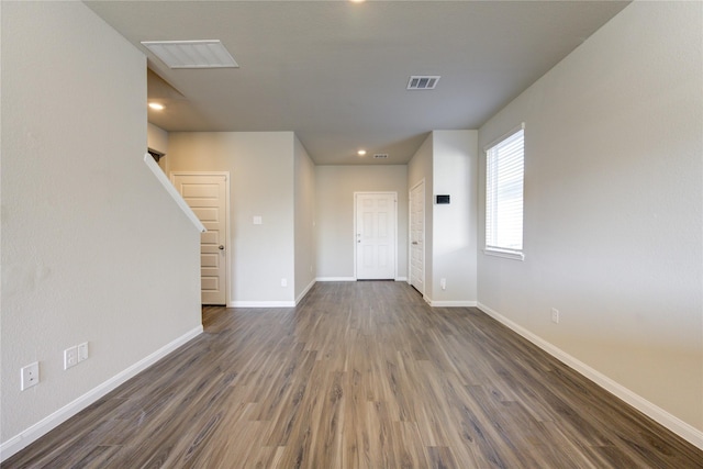 unfurnished room with dark hardwood / wood-style flooring