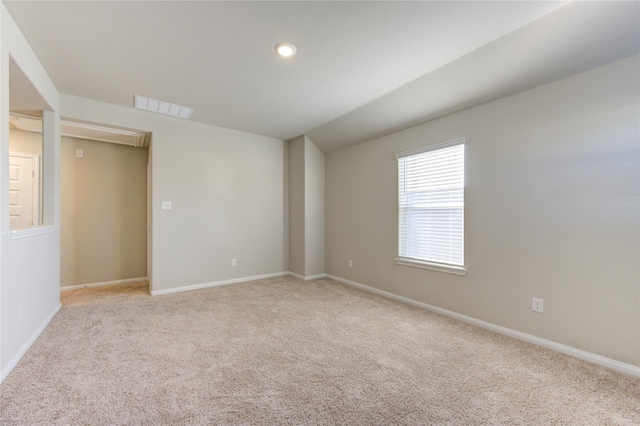 empty room with light colored carpet