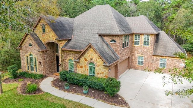 tudor house featuring a garage