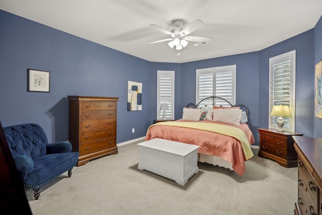 bedroom featuring ceiling fan and light colored carpet