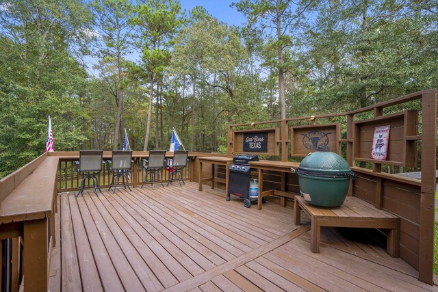 wooden deck with area for grilling