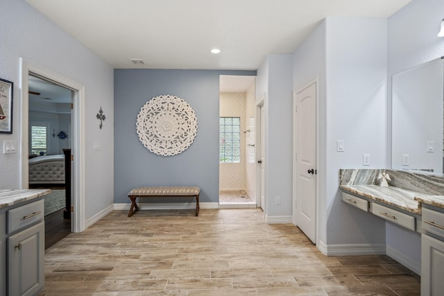 bathroom featuring hardwood / wood-style floors and vanity