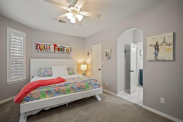 bedroom with ceiling fan and light colored carpet