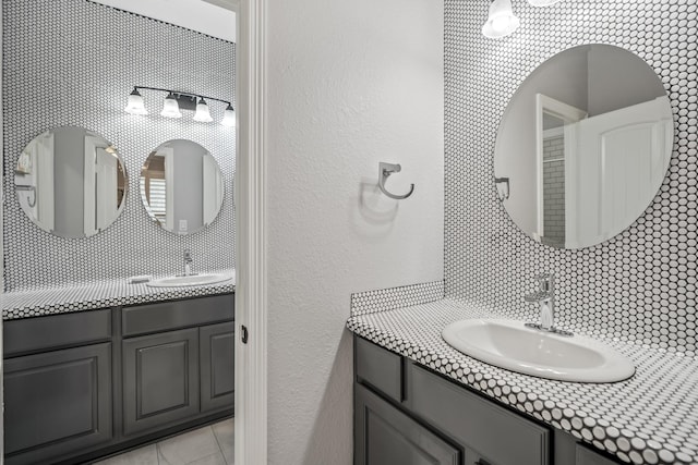 bathroom featuring decorative backsplash and vanity