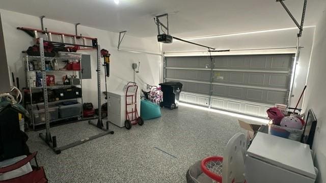 garage featuring a garage door opener