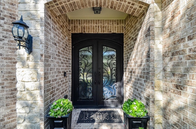 doorway to property featuring french doors