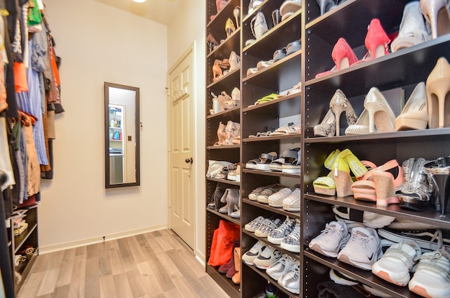 walk in closet featuring light wood-type flooring