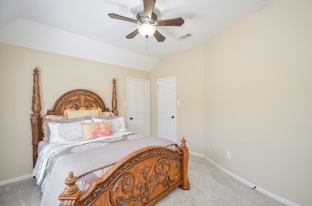 carpeted bedroom featuring ceiling fan and lofted ceiling