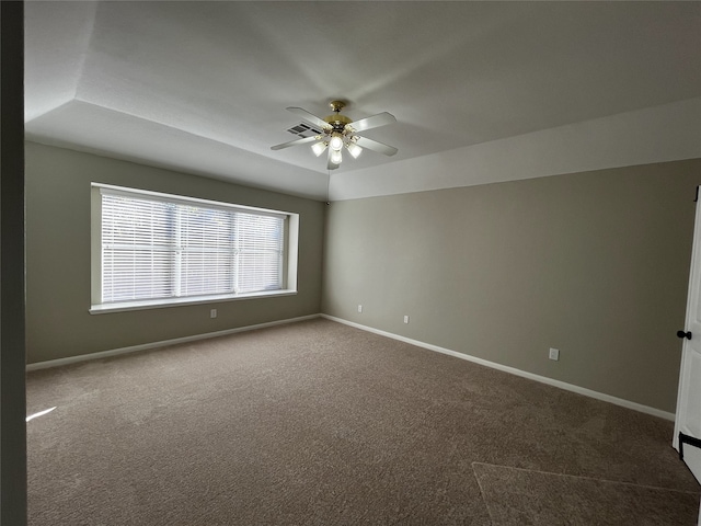 spare room featuring carpet, ceiling fan, and lofted ceiling