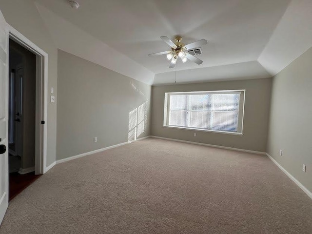 interior space featuring carpet, ceiling fan, and vaulted ceiling