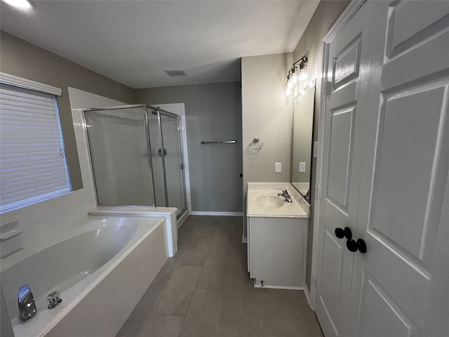 bathroom featuring vanity and separate shower and tub