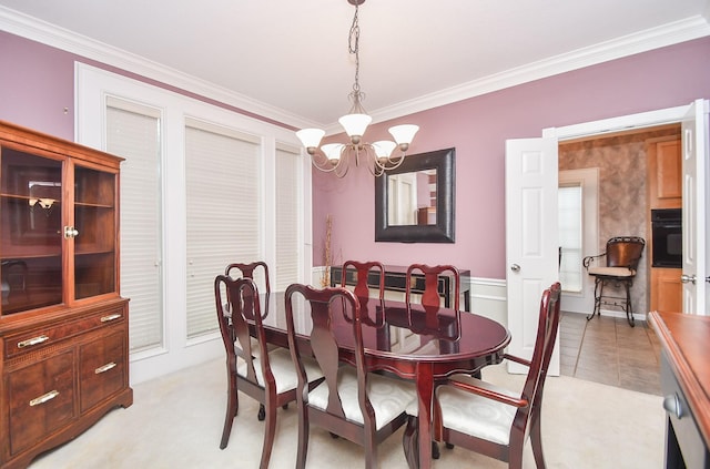 tiled dining area with a notable chandelier and ornamental molding