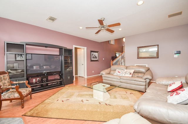 living room with ceiling fan and hardwood / wood-style floors