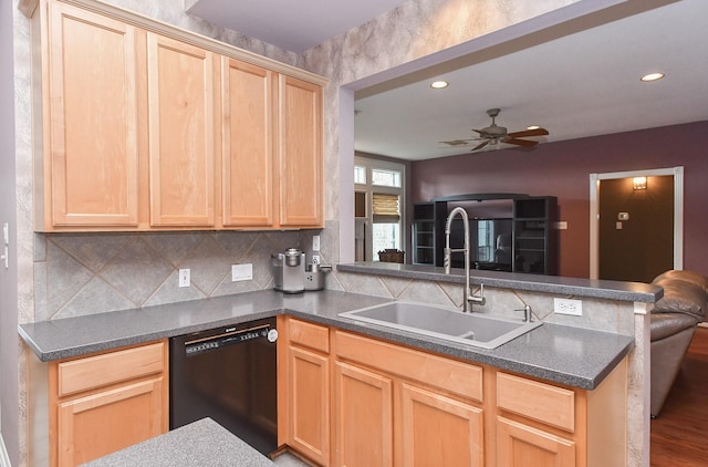 kitchen featuring hardwood / wood-style floors, dishwasher, sink, light brown cabinetry, and kitchen peninsula