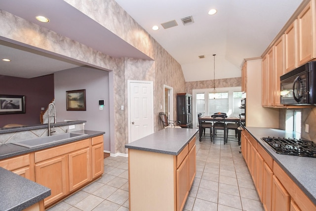 kitchen featuring sink, a center island, light brown cabinets, pendant lighting, and vaulted ceiling