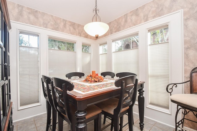2446 Plantation Bend Dr, Sugar Land, TX 77478 - dining area with healthy amount of natural light, light tile patterned floors, and baseboards