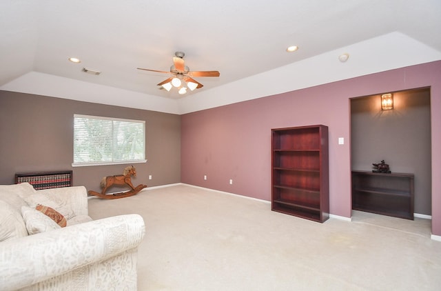 carpeted living room with vaulted ceiling and ceiling fan