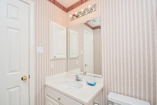 bathroom with vanity and toilet