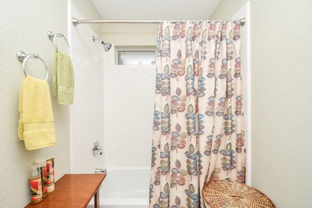 bathroom featuring shower / bath combination with curtain