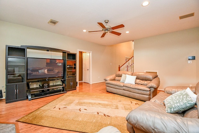 2446 Plantation Bend Dr, Sugar Land, TX 77478 - living area with wood finished floors, a ceiling fan, recessed lighting, stairs, and baseboards