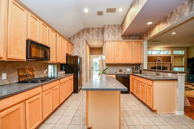 2446 Plantation Bend Dr, Sugar Land, TX 77478 - kitchen featuring black appliances, light brown cabinets, a peninsula, dark countertops, and lofted ceiling