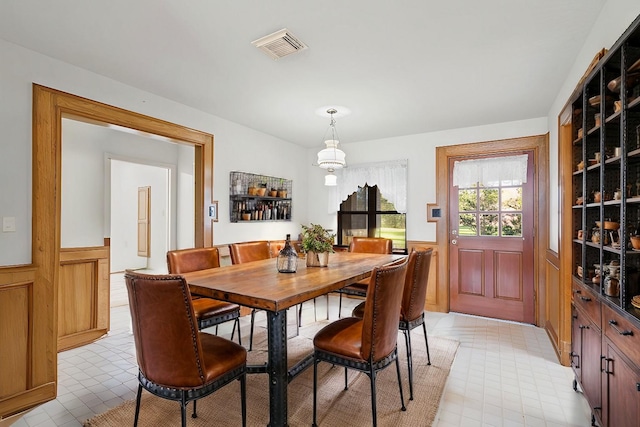 dining area with wood walls