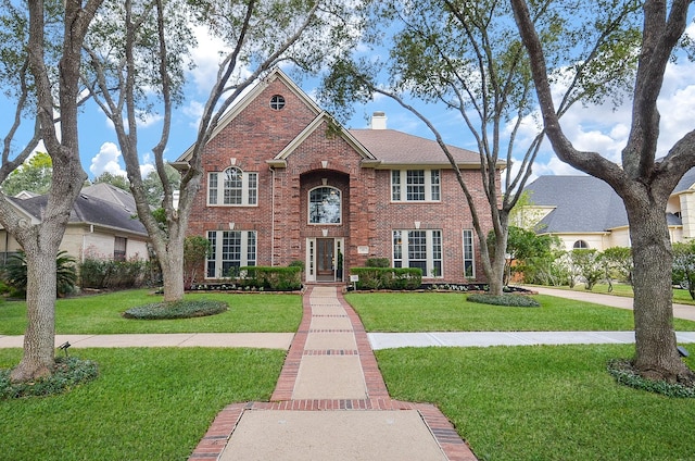 view of front facade with a front lawn