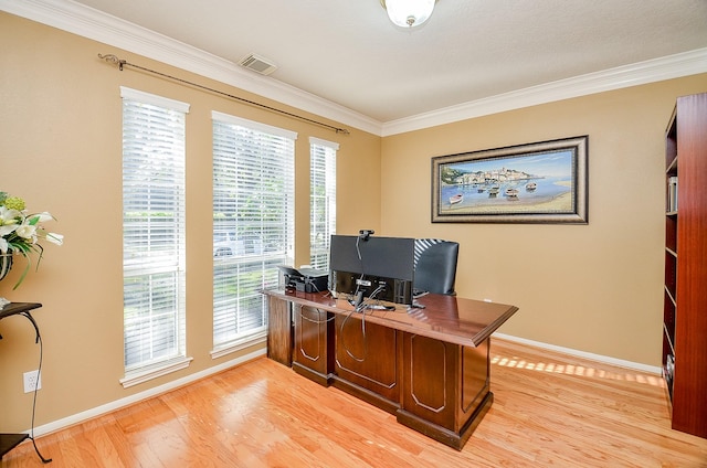 office area with crown molding, a healthy amount of sunlight, and light hardwood / wood-style floors