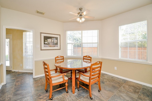 dining room with ceiling fan and plenty of natural light