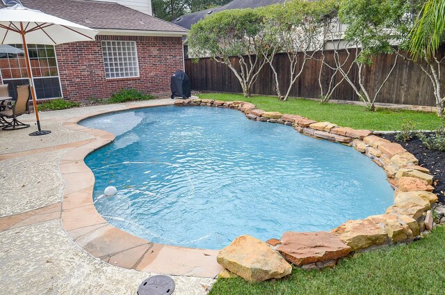 view of pool with grilling area