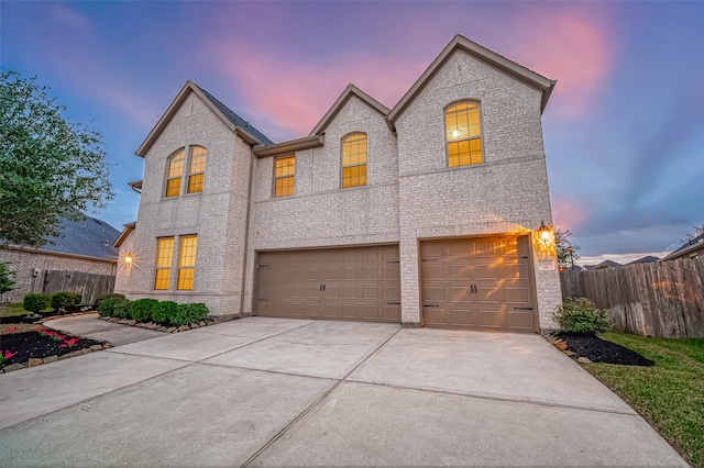 french provincial home with a garage