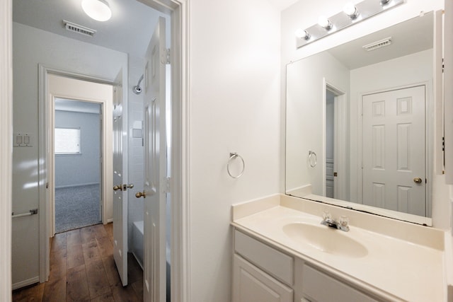 bathroom featuring hardwood / wood-style floors and vanity